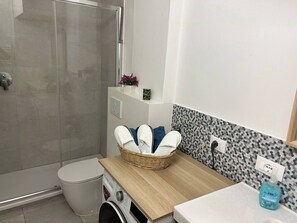 Hair dryer, towels, soap, toilet paper
