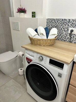 Hair dryer, towels, soap, toilet paper