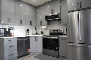 Fridge, microwave, oven, stovetop - The Cozy Nook of Seton (Calgary)