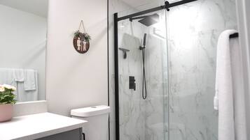 Shower, hair dryer, towels, soap