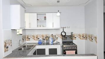 Classic Apartment | Private kitchen | Fridge, microwave, cookware/dishes/utensils