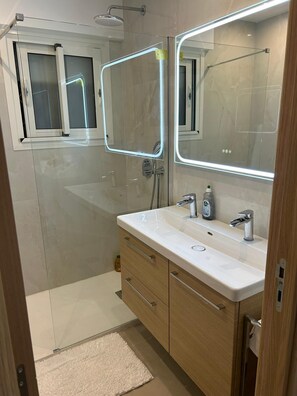 Shower, hair dryer, towels, soap