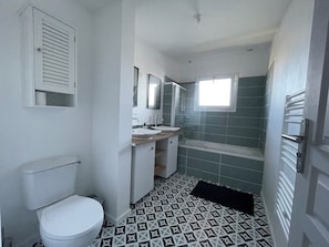 Shower, towels, soap, toilet paper