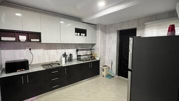 Fridge, microwave, electric kettle, cookware/dishes/utensils