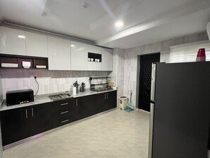 Fridge, microwave, electric kettle, cookware/dishes/utensils