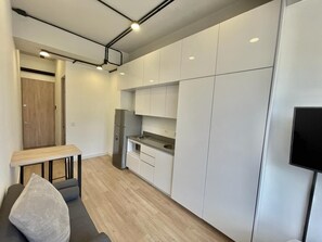 Comfort Apartment, Kitchenette, City View | In-room safe, laptop workspace, iron/ironing board, free WiFi