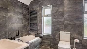 Jetted bath, hair dryer, towels, soap