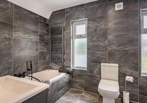 Jetted bath, hair dryer, towels, soap