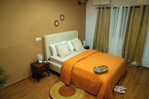 1 bedroom, desk, iron/ironing board, travel crib