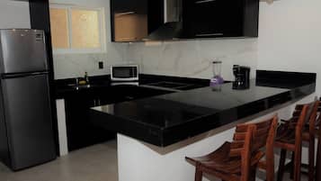 Family Apartment, City View | Private kitchen | Fridge, microwave, stovetop, cookware/dishes/utensils