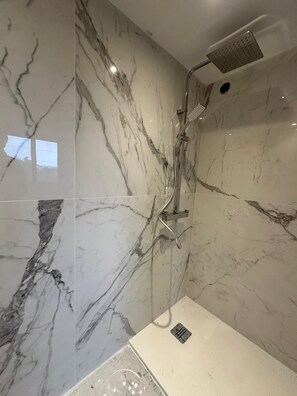 Shower, hair dryer, towels, toilet paper