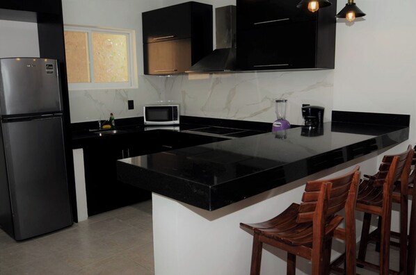 Fridge, microwave, stovetop, cookware/dishes/utensils