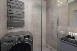 Shower, hair dryer, towels, shampoo
