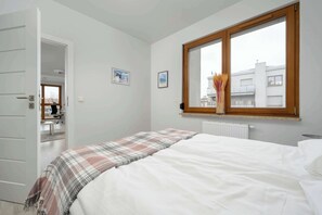 1 bedroom, desk, iron/ironing board, travel crib