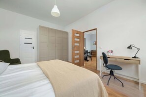 1 bedroom, desk, iron/ironing board, travel crib
