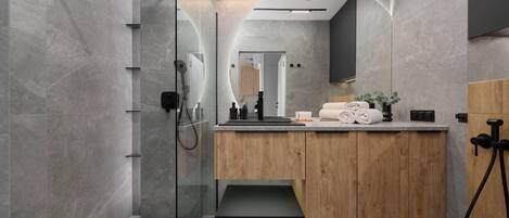 Shower, hair dryer, towels, shampoo