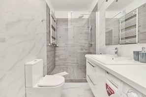 Shower, hair dryer, towels, shampoo