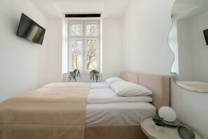 1 bedroom, desk, iron/ironing board, travel crib