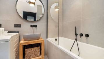 Shower, hair dryer, towels, shampoo