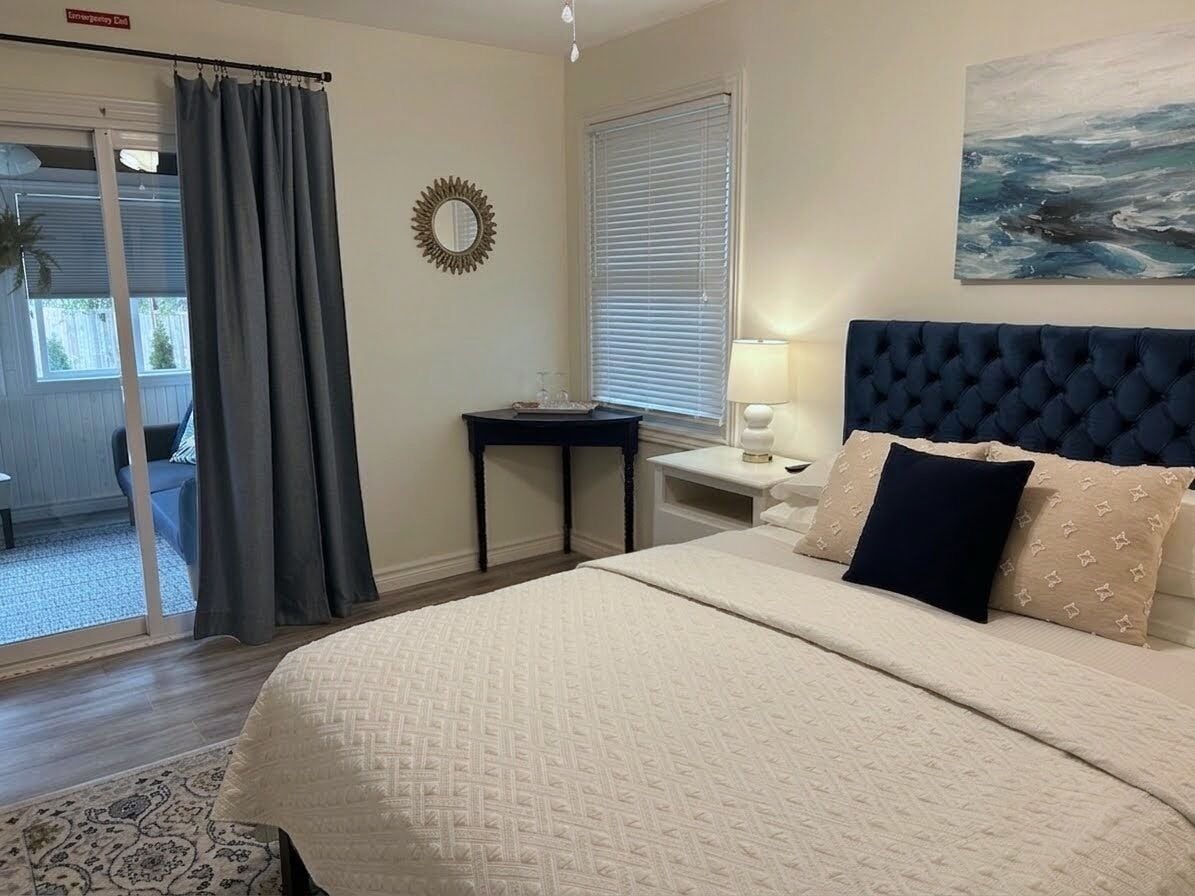 Suite Deluxe, vista al jardín | Cortinas blackout, tabla de planchar con plancha y wifi gratis 