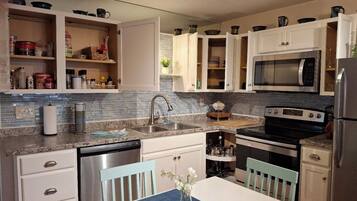 MANATEE APARTMENT | Private kitchen | Full-size fridge, microwave, oven, stovetop