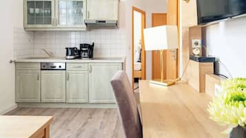 Fridge, stovetop, dishwasher, coffee/tea maker