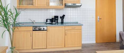 Fridge, stovetop, dishwasher, coffee/tea maker