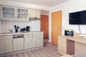 Fridge, stovetop, dishwasher, coffee/tea maker