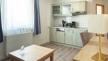 Fridge, stovetop, dishwasher, coffee/tea maker