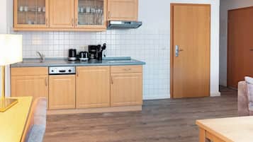 Fridge, stovetop, dishwasher, coffee/tea maker