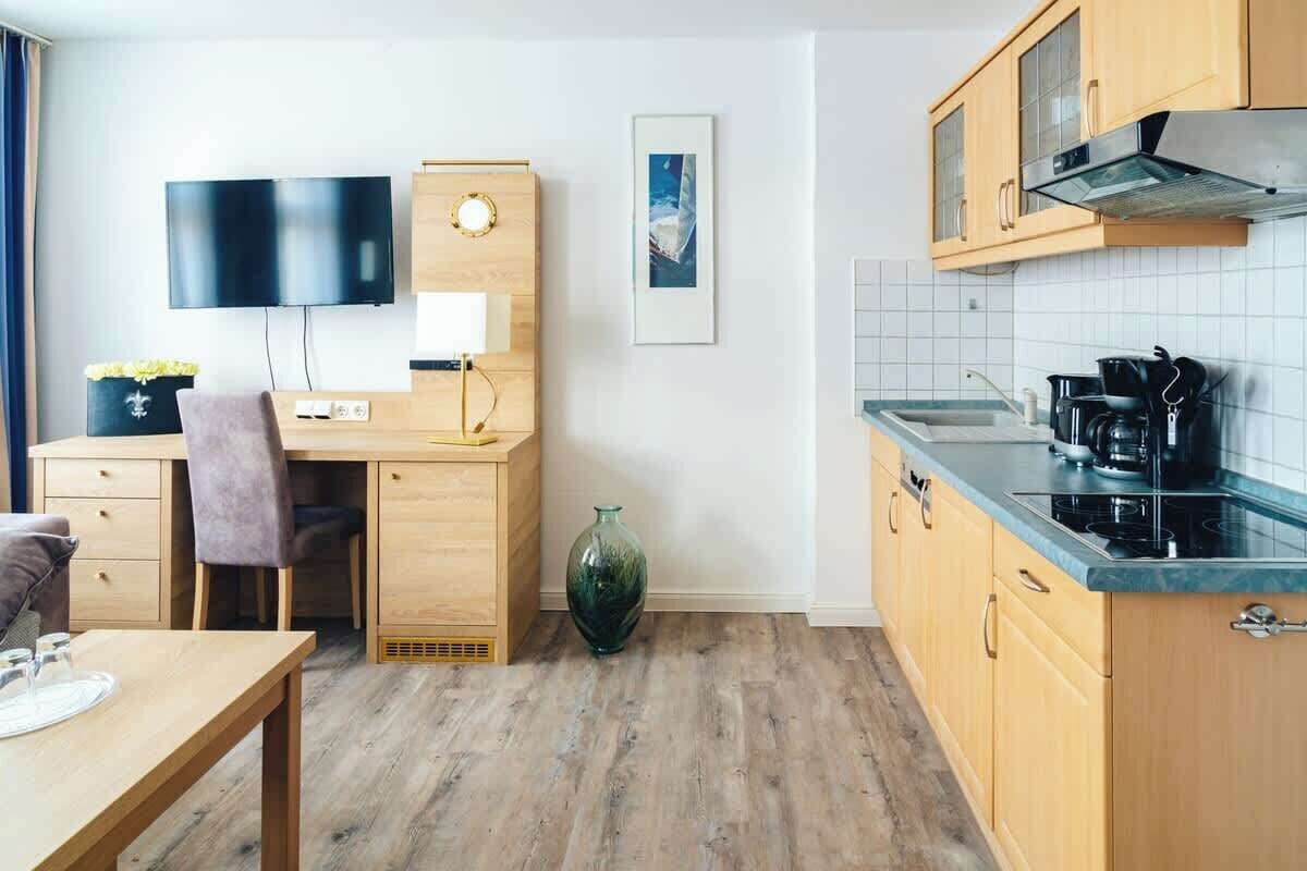 Een koelkast, een kookplaat, een vaatwasser