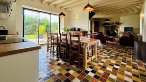 A spacious kitchen with a dining area, large windows, and a tiled floor. - Clos du Haut Gallion, An authentic haven of peace (Saint-Cyr)