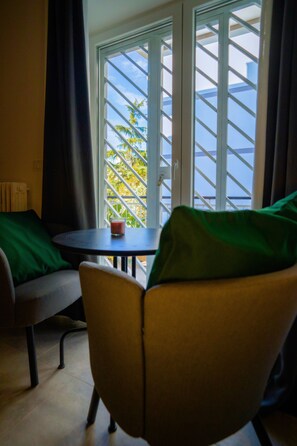 Deluxe Double Room, Balcony, Courtyard View | Minibar, laptop workspace, blackout drapes, soundproofing - YOU Rhome in Garbatella (Rome)