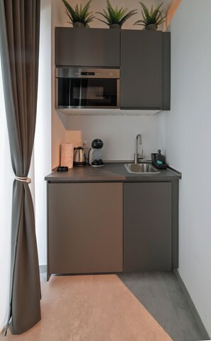 Deluxe Double Room, Balcony, Courtyard View | Private kitchen | Fridge, cookware/dishes/utensils