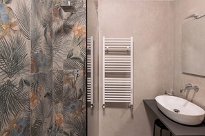 Luxury Double Room, Balcony, Courtyard View | Bathroom | Hair dryer, slippers, towels, soap - YOU Rhome in Garbatella (Rome)