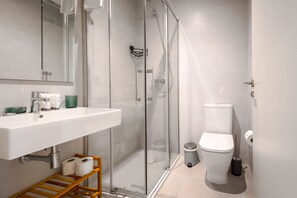 Shower, hair dryer, towels, soap