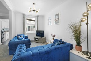 Family House, Patio | Living area | 42-inch Smart TV with satellite channels, Netflix, streaming services - Charming 3 Bed House at Blakes Cottages (Reading)