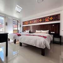 Kamar Triple Deluks, kamar mandi pribadi, pemandangan resor | Wi-Fi gratis dan seprai linen