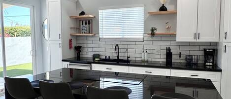 Microwave, stovetop, dishwasher, coffee/tea maker