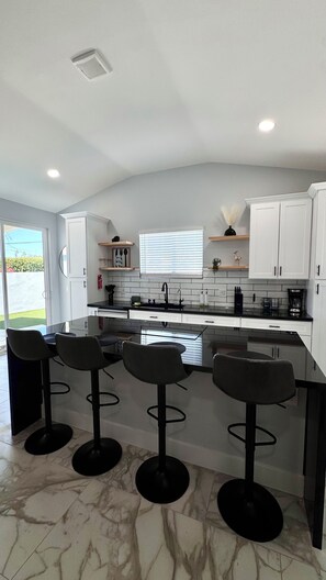 Microwave, stovetop, dishwasher, coffee/tea maker