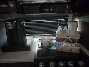 Fridge, microwave, coffee/tea maker, cookware/dishes/utensils
