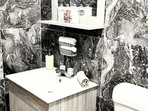 Shower, hair dryer, towels, soap