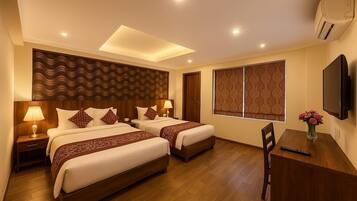 Deluxe Double or Twin Room, City View | Desk, laptop workspace, soundproofing, iron/ironing board