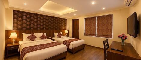 Deluxe Double or Twin Room, City View | Desk, laptop workspace, soundproofing, iron/ironing board