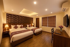 Deluxe Double or Twin Room, City View | Desk, laptop workspace, soundproofing, iron/ironing board