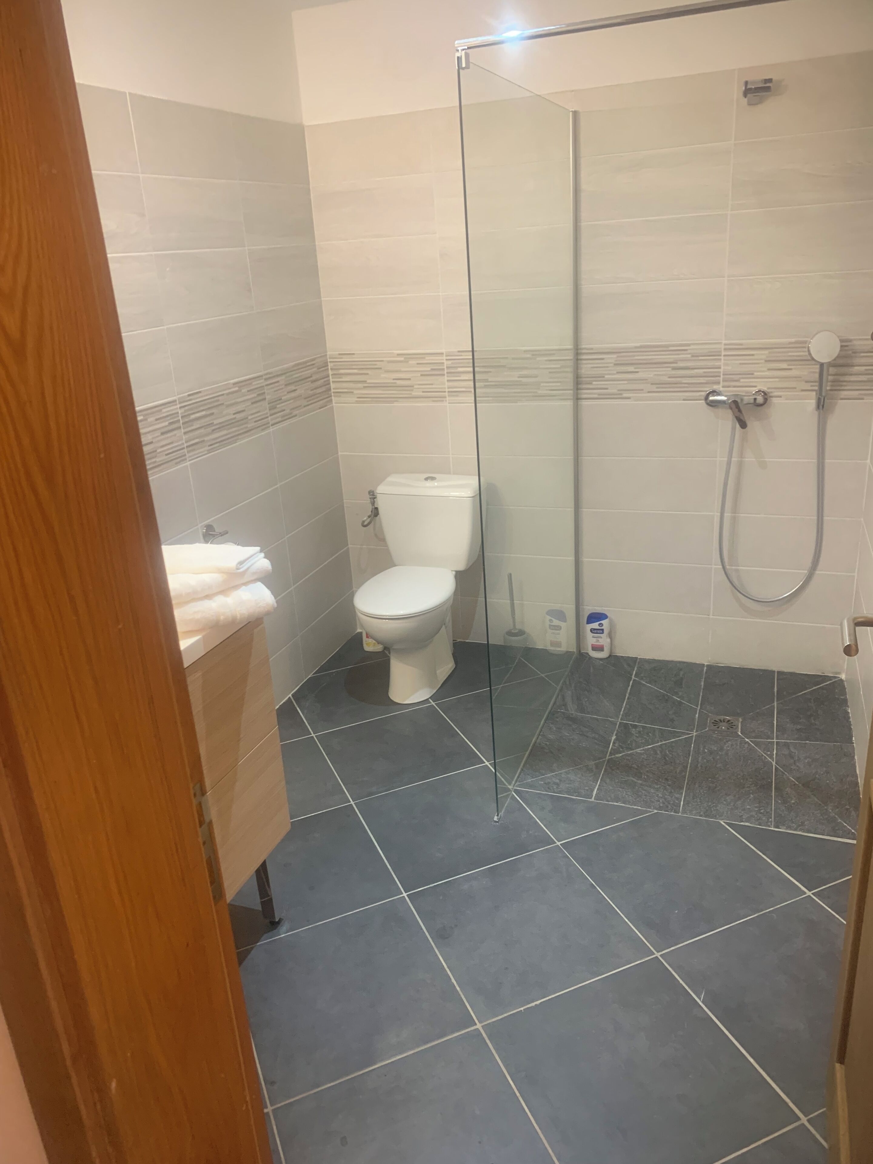 Shower, towels, soap, shampoo