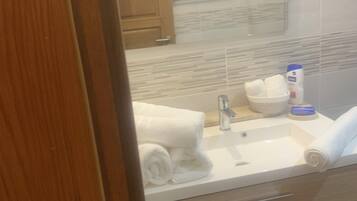 Shower, towels, soap, shampoo