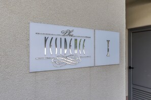 A wall-mounted sign with the text 'The' and a decorative design. - Beachfront Penthouse Residence (Podstrana)