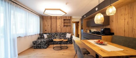 Apartment, Garden View, Mountainside | Living area | 50-inch LED TV with cable channels