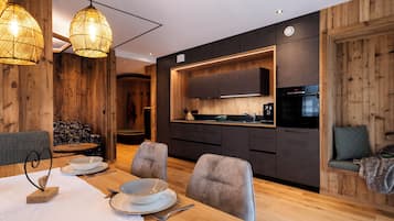 Apartment, Garden View, Ground Floor | Living area | 50-inch LED TV with cable channels